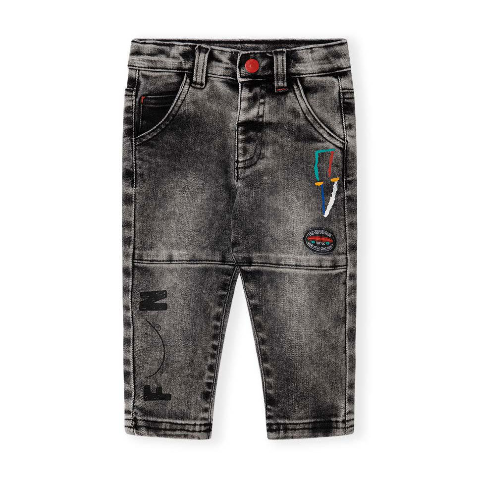 
Schwarze Jeans aus der Tuc Tuc Girl's Clothing Line, mit kleinen farbigen Prints auf der Vorders...